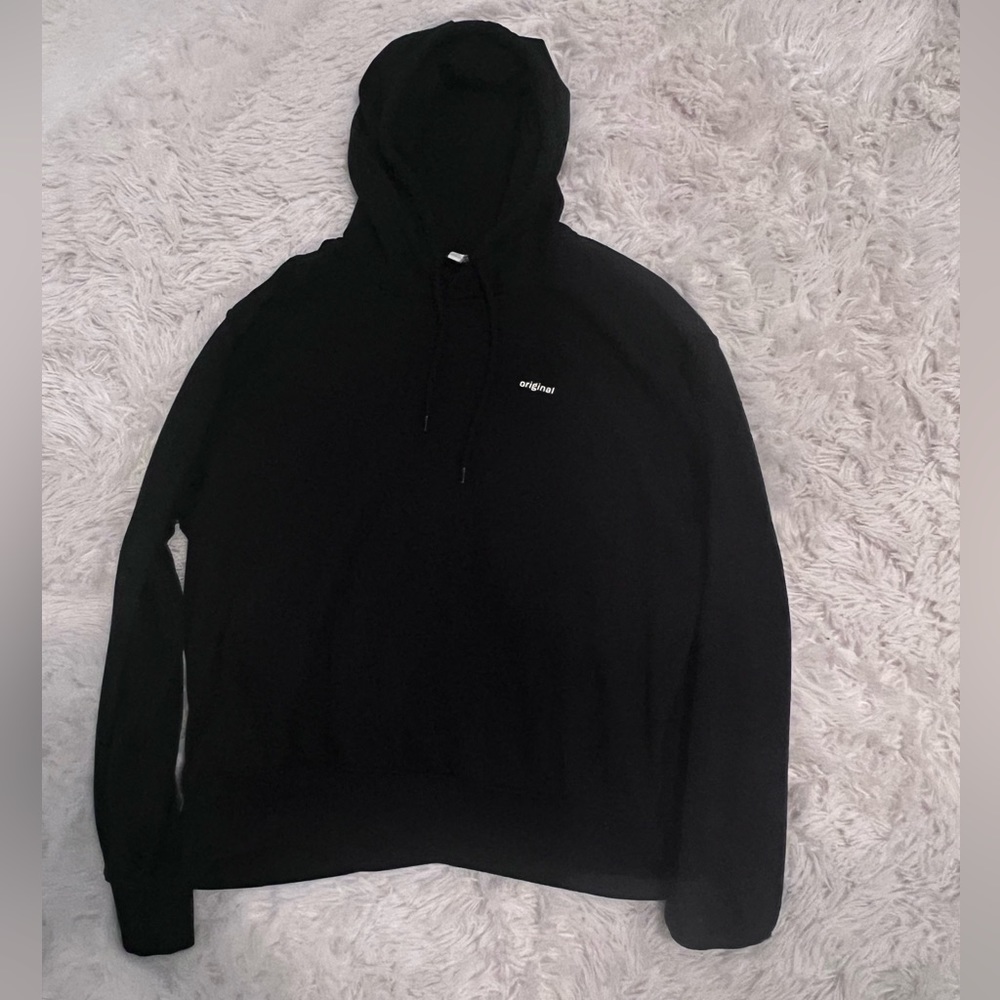 black sweatshirt. says “original” in the top right. medium